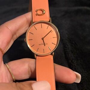 Coach Women's Peach Watch with Gold Accents
